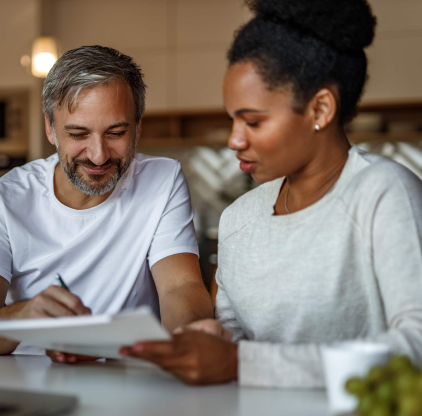Two people looking at paper work